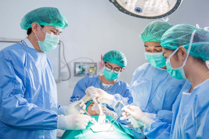 doctors performing surgery image